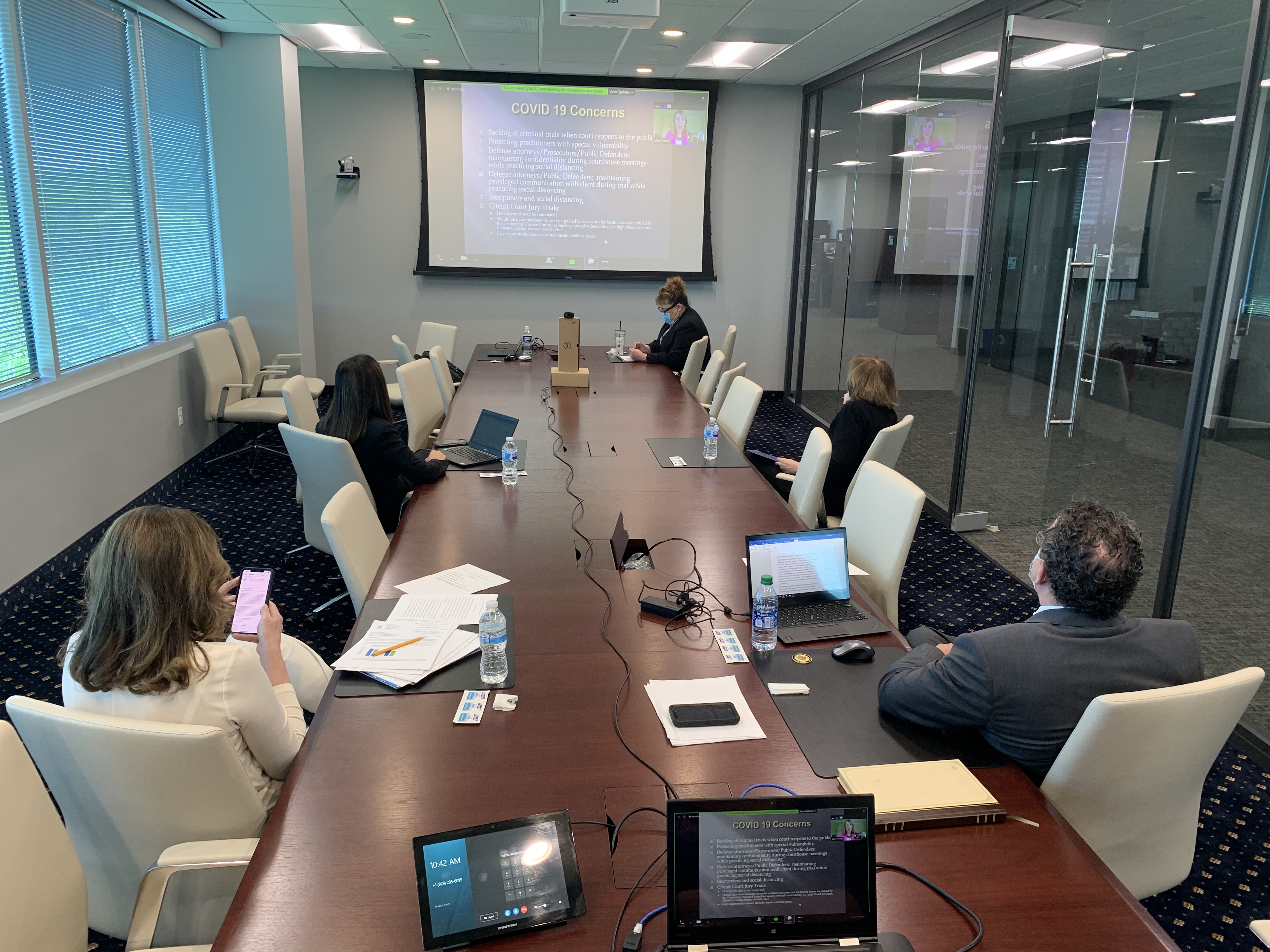 Photo of Maryland Judiciary leadership in conference room listening to presentations