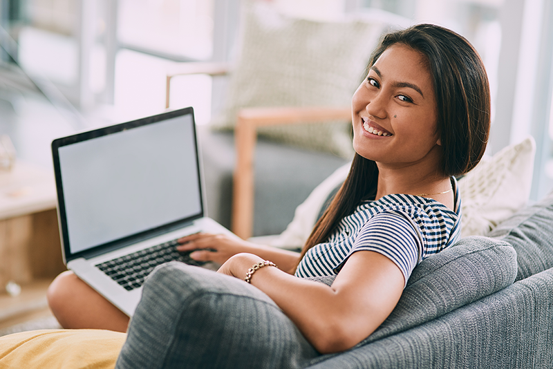 woman at computer looking at camera