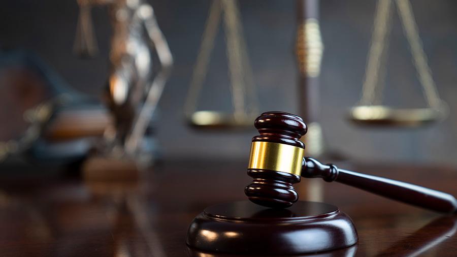 Gavel and scales on desk